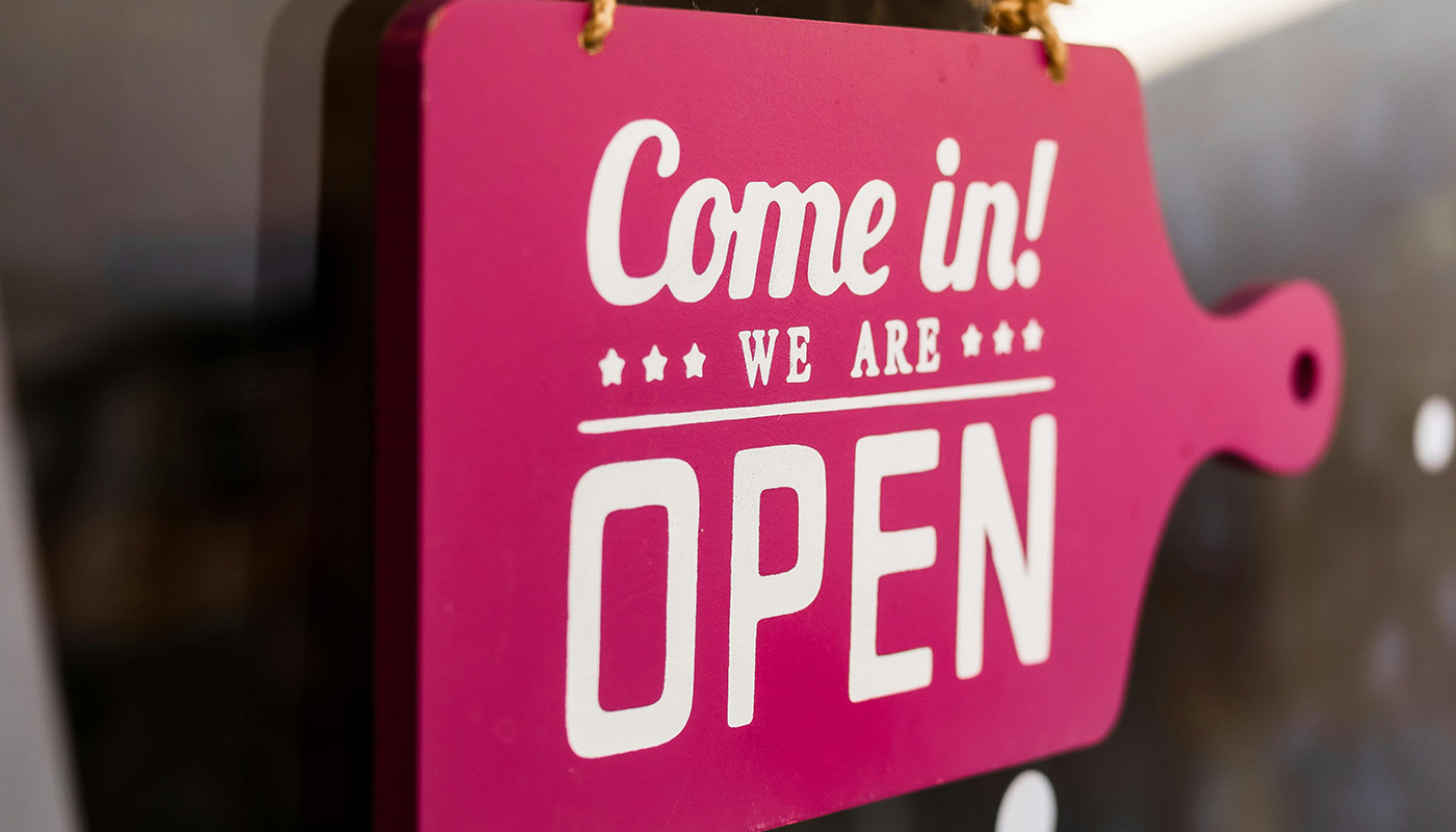 Pink opening sign for new business.