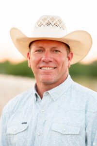 Man wearing a cowboy hat.