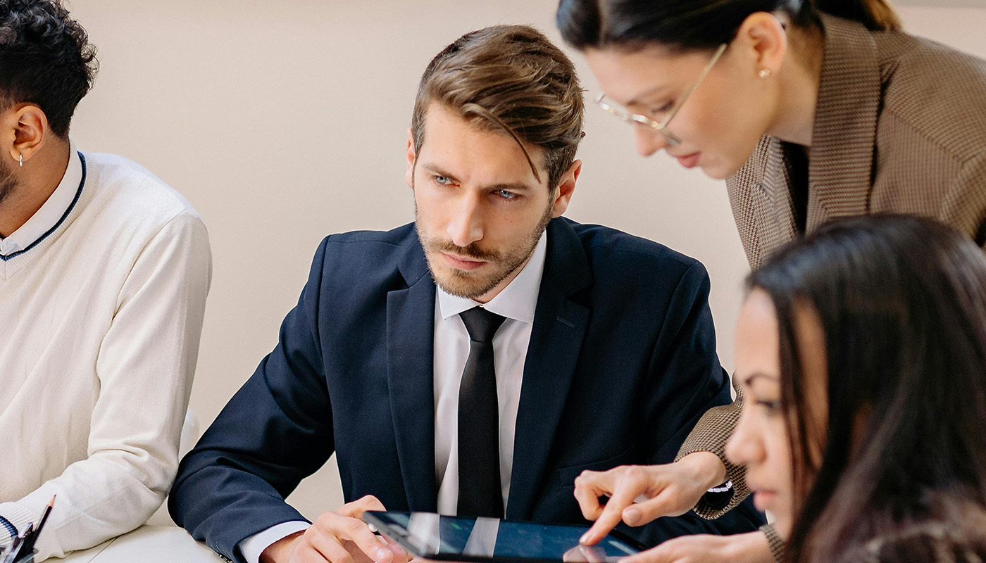Team of individuals working on taxes.