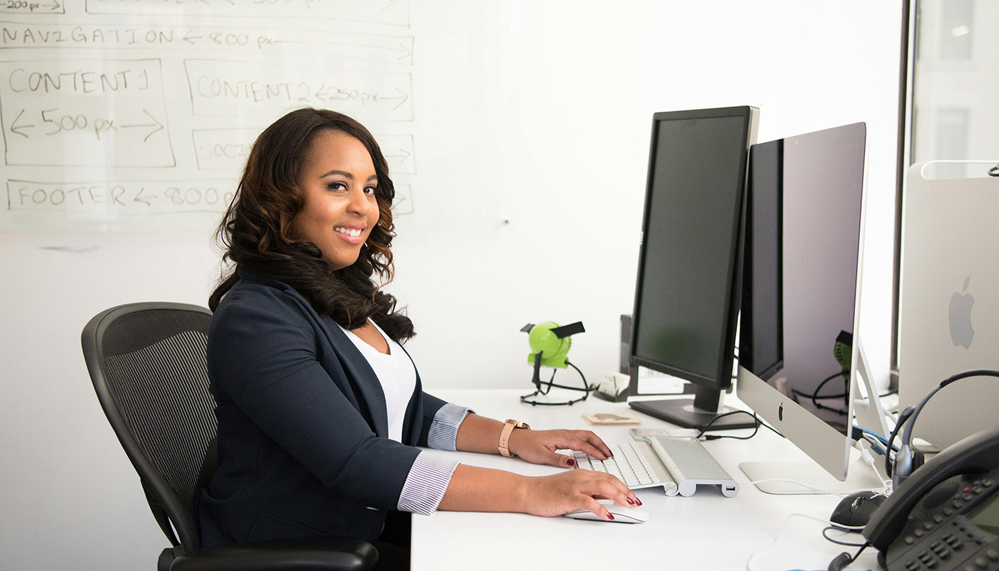 Woman at work smiling at camera.