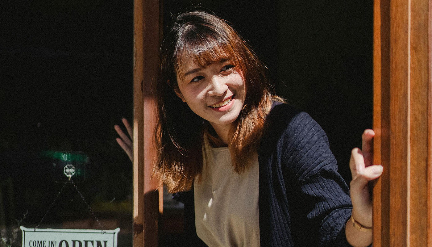 Business owner opening her shop.