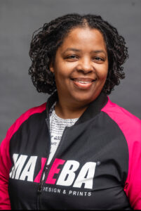 A woman smiling at the camera.